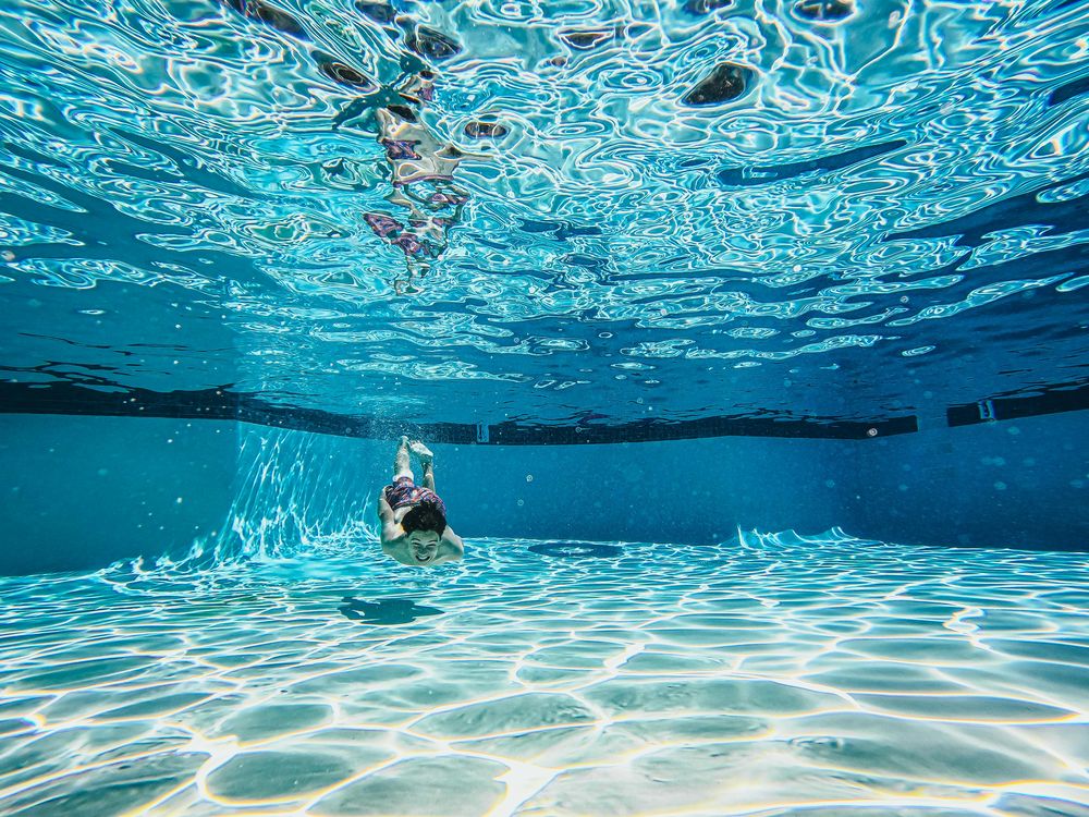 pool surface underwater child swimming